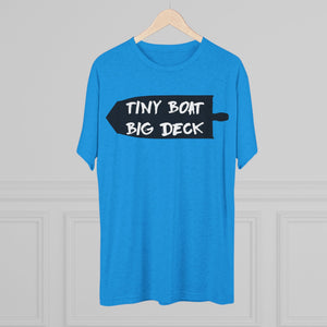 Blue t-shirt with 'Tiny Boat Big Deck' text on a hanger against a gray background