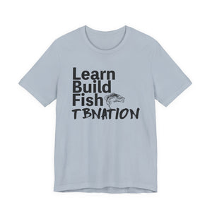 Light blue t-shirt with black text and fish graphic on a white background