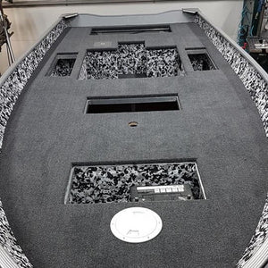 Dark gray 20 oz marine grade premium boat carpet installed in a boat deck, with black and white camouflage accents.