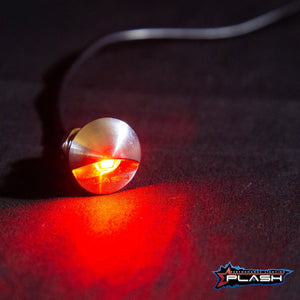 PlashLights flush mounted LED step light with a stainless steel housing emitting a red glow.