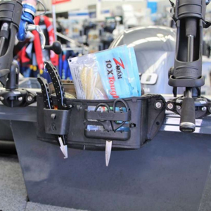Black Railblaza Track Mount Tackle Caddy on a boat, holding lures, pliers, and fishing tools.
