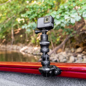 Black Railblaza Trackloader Sideport with a GoPro camera attached to a boat's red gunnel.
