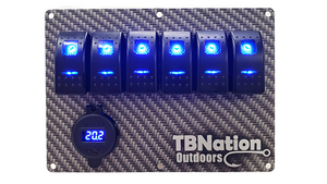 TBNation 6-gang carbon fiber hydro-dipped aluminum switch panel with blue LED rocker switches and voltmeter.