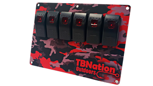 TBNation 6-gang rocker switch panel with red camouflage hydro-dipped aluminum plate and black switches.