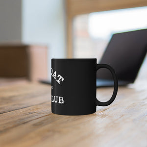 11oz black ceramic mug with white "GOAT CLUB" design on a wooden desk.