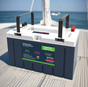 Dark gray and white 12V 300Ah LiFePO4 dual-purpose battery with handles on a boat deck.