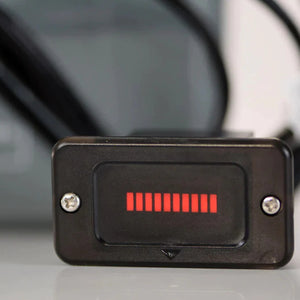 Black rectangular battery indicator with red LED bars showing charge level.