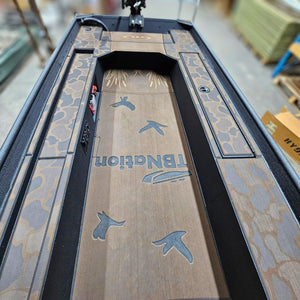 Custom 1436 duck boat deck with espresso over black camo HydroTurf, laser-engraved ducks, and "TBNation" logo.