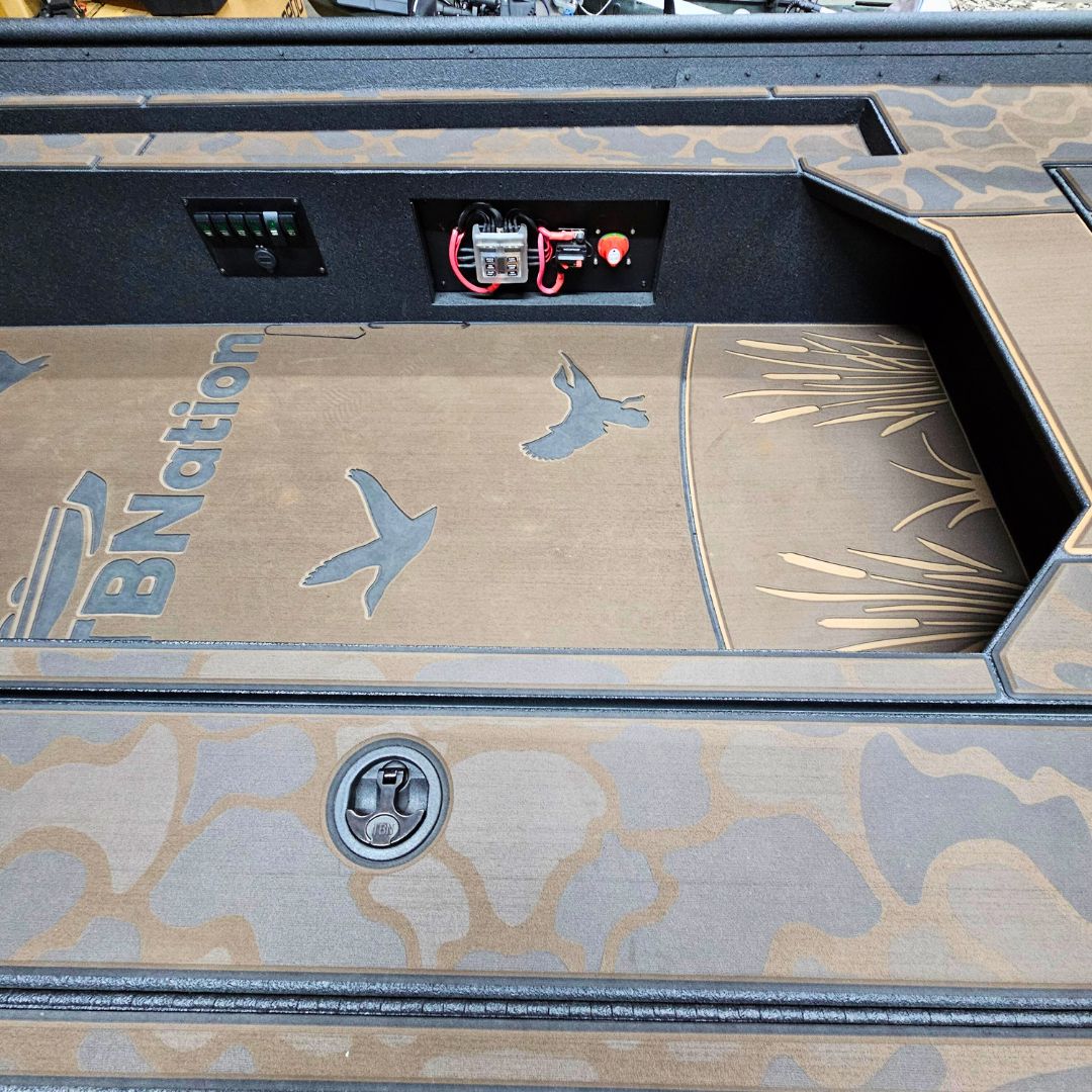 Custom 1436 duck boat deck with laser-engraved HydroTurf featuring ducks and reeds, Espresso over Black paint.