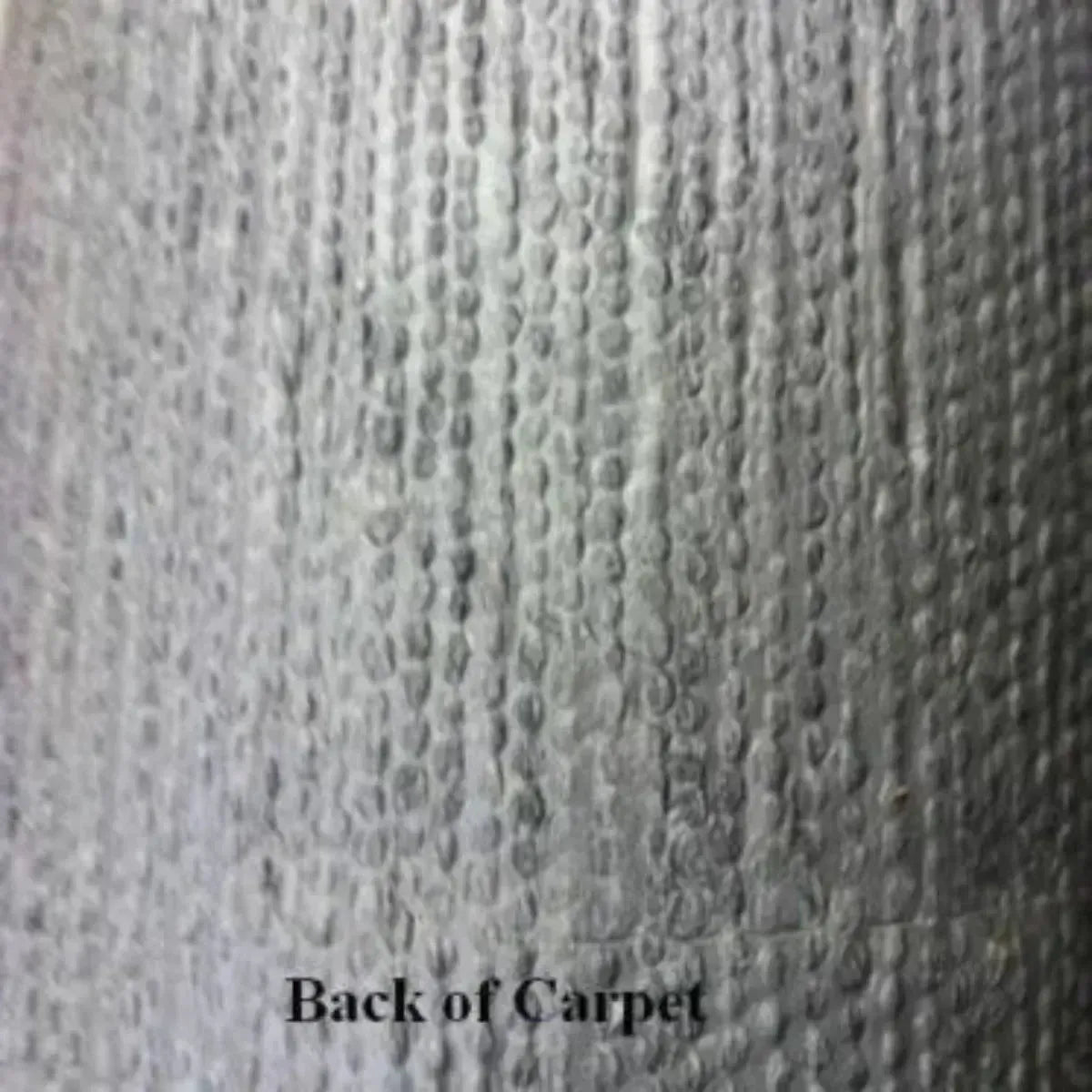 Close-up of the textured, dark gray backing of 20 oz cut pile marine grade boat carpet.