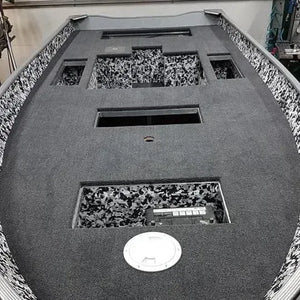 Dark gray 20 oz marine grade premium boat carpet installed in a boat deck, with black and white camouflage accents.
