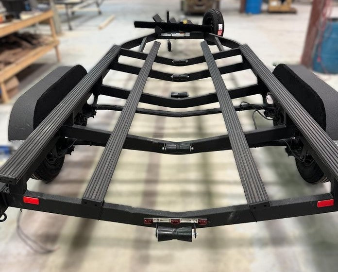 Black boat trailer with Gatorbak GB350 XP synthetic bunk covers for 2x4 flat bunks.