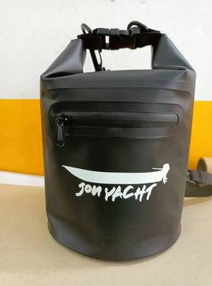 Black 5L Jon Yacht dry bag with roll-top buckle closure, front zipper pocket, and white logo.