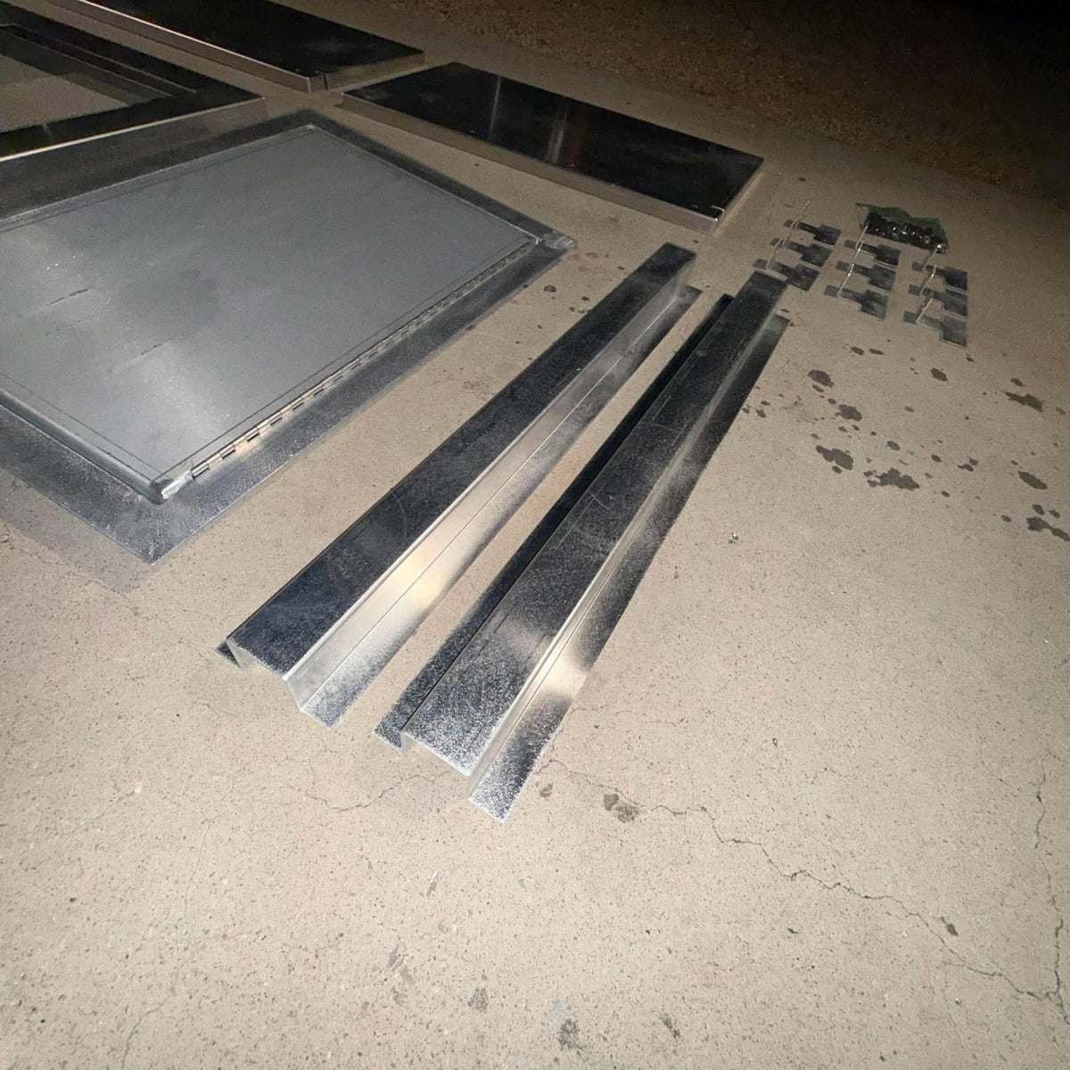 Fast-install, trim-to-fit aluminum Deck in a Box kit for jon boats, featuring flat panels and support beams.