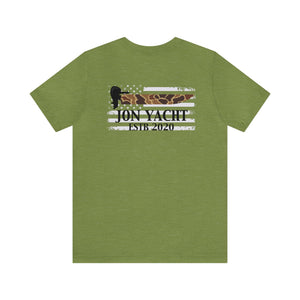 Olive green unisex cotton tee with "Jon Yacht ESTB 2020" over a distressed American flag in camo and white stripes.