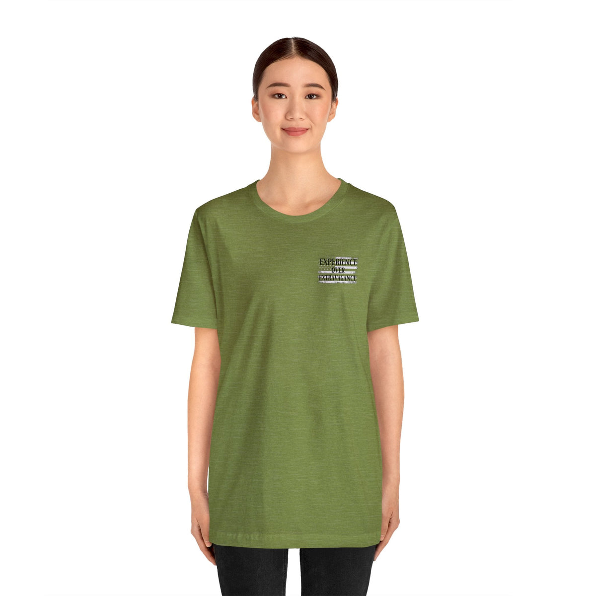 Woman wearing an olive green "American Dreamer" unisex jersey tee with "EXPERIENCE IS INTELLIGENCE" text.
