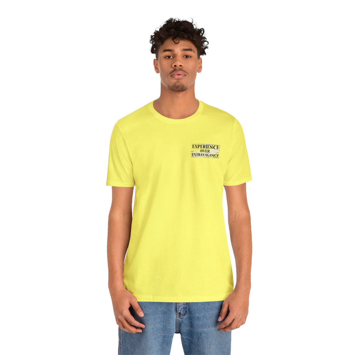 Man in a yellow "American Dreamer" t-shirt with "EXPERIENCE OVER EXTRAVAGANCE" text.