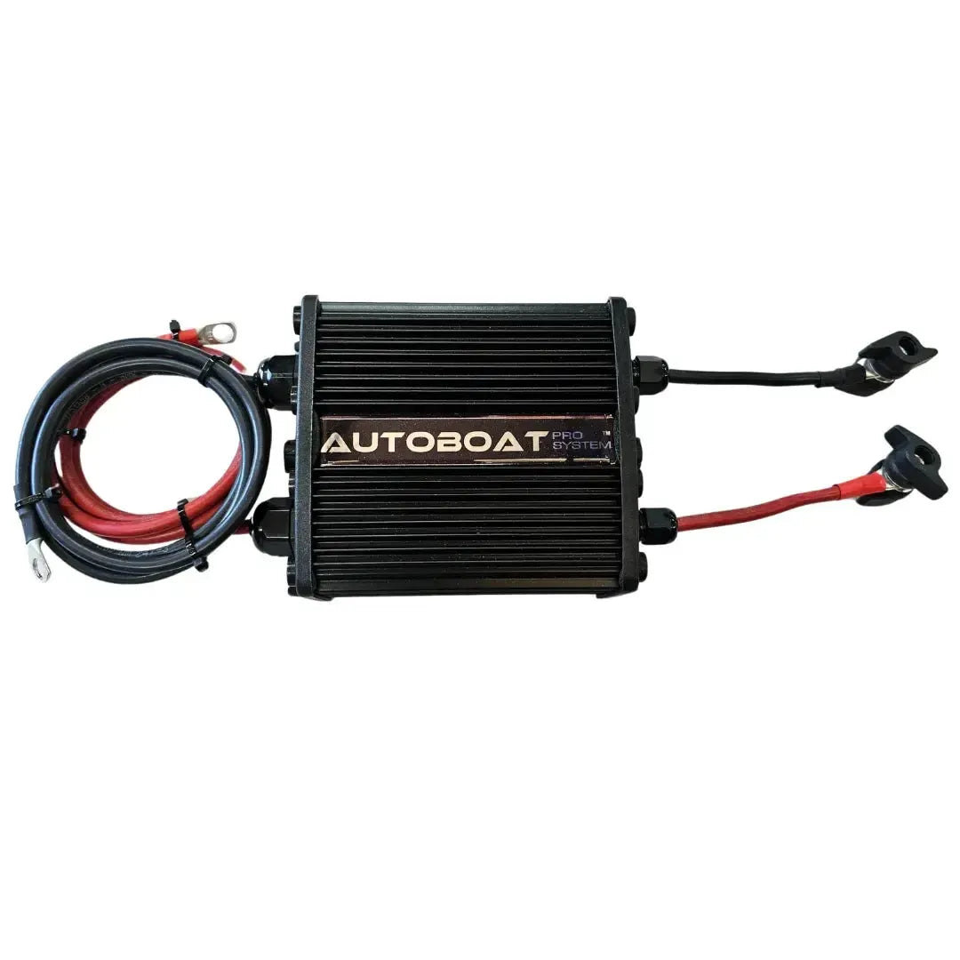 Autoboat ATM Pro Black Box, a rectangular black metal unit with ribbed sides and attached red and black cables.