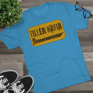 Blue CAMO Tiller Mafia Tee with distressed yellow graphic, soft cotton fabric, and retail fit.