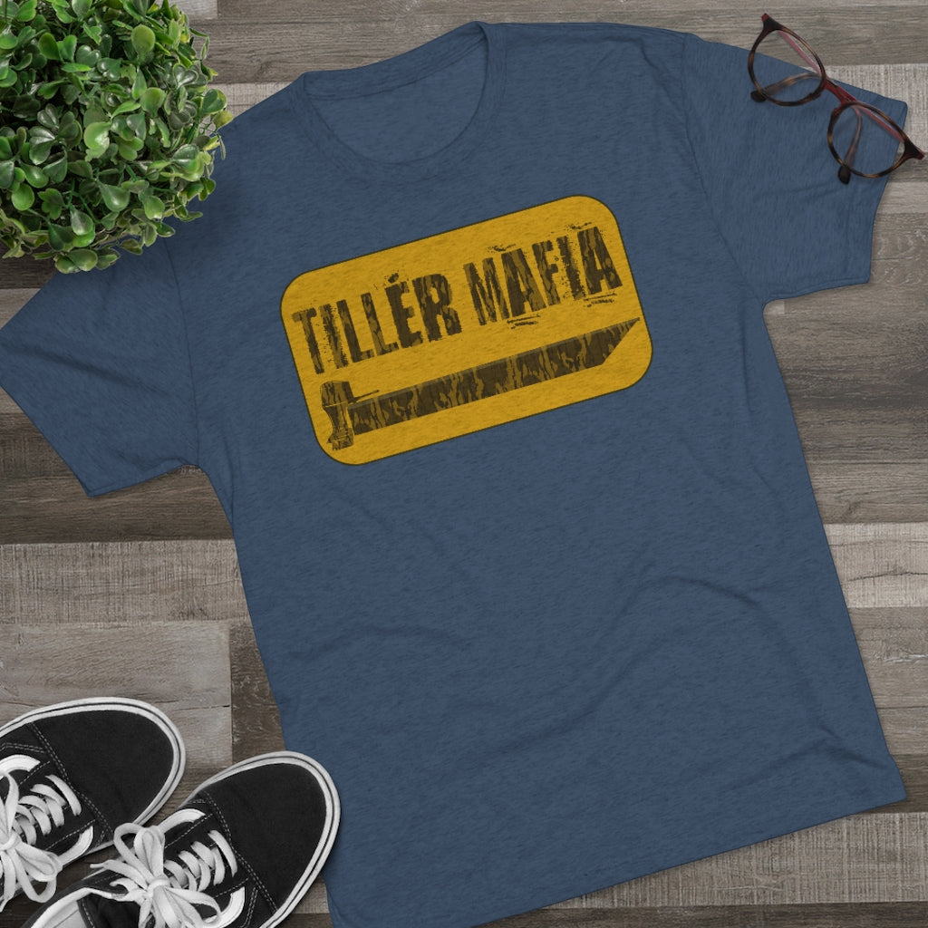 Blue CAMO Tiller Mafia Tee with a distressed yellow rectangular graphic featuring a tiller blade.