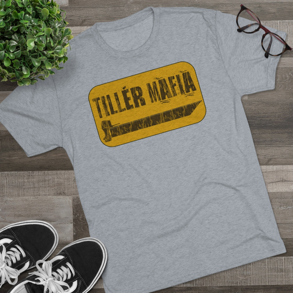 Light gray CAMO Tiller Mafia Tee with a distressed yellow and black graphic, soft cotton fabric.