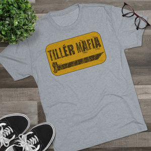 Light gray CAMO Tiller Mafia Tee with a distressed yellow and black graphic, soft cotton fabric.