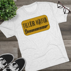Light grey CAMO Tiller Mafia Tee with a yellow distressed logo featuring a tiller blade design.