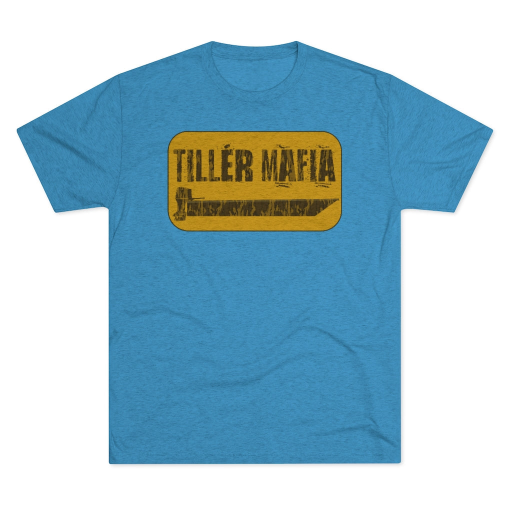 Blue CAMO Tiller Mafia Tee with a distressed yellow rectangular graphic featuring a tiller handle and boat.