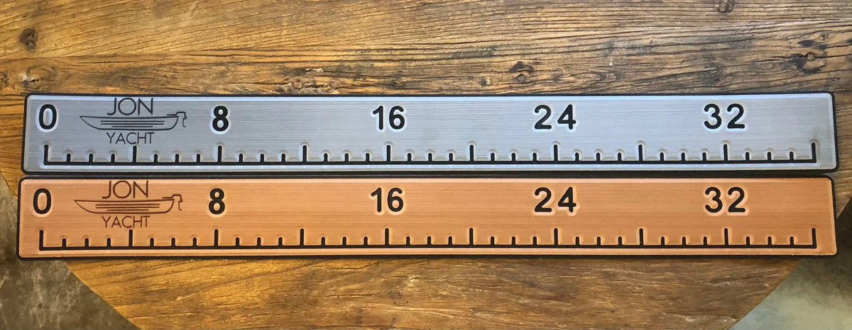 Two 38 1/4" x 4" ruler pads, one silver and one bronze, with "JON YACHT" logo and measurements.