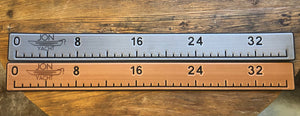 Two 38 1/4" x 4" ruler pads, one silver and one bronze, with "JON YACHT" logo and measurements.