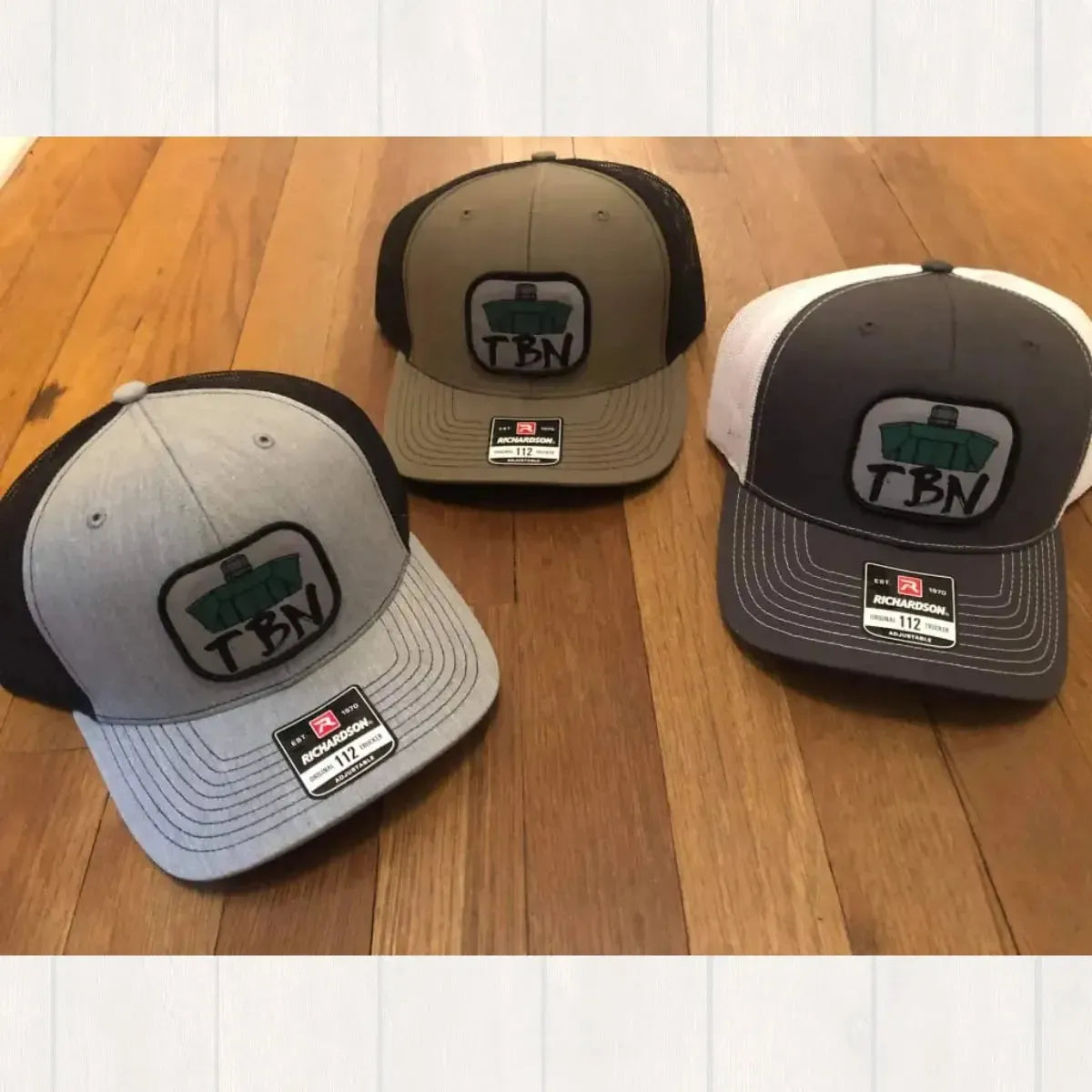 Richardson 112 hats in gray, black, and green, featuring an embroidered TBN Jon Boat patch.
