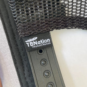 Black mesh trucker hat with a "TBNation Tiny Boat Nation" tag and adjustable snapback closure.