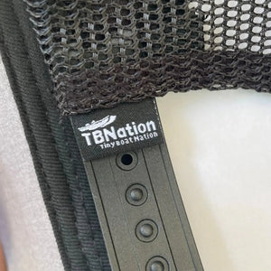 Black mesh trucker hat with a "TBNation Tiny Boat Nation" tag and adjustable snapback closure.
