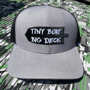 Gray trucker hat with black mesh back and "TINY BOAT BIG DECK" patch.