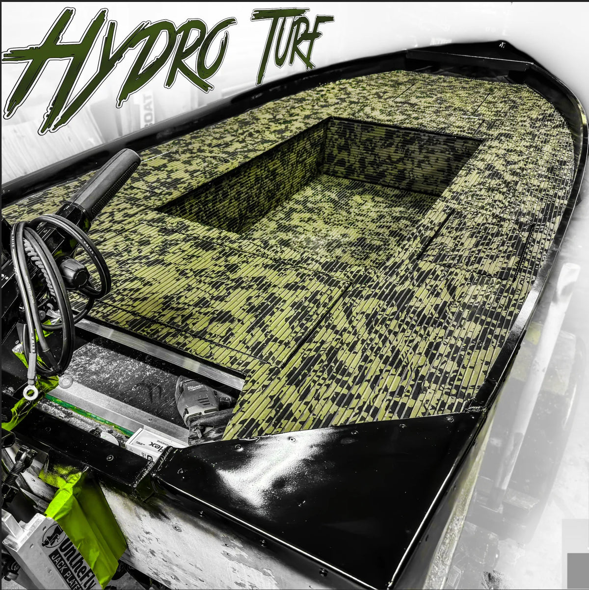 Hydro Turf Cut Groove EVA foam traction mat in TBNation Camo, installed on a black jon boat deck.