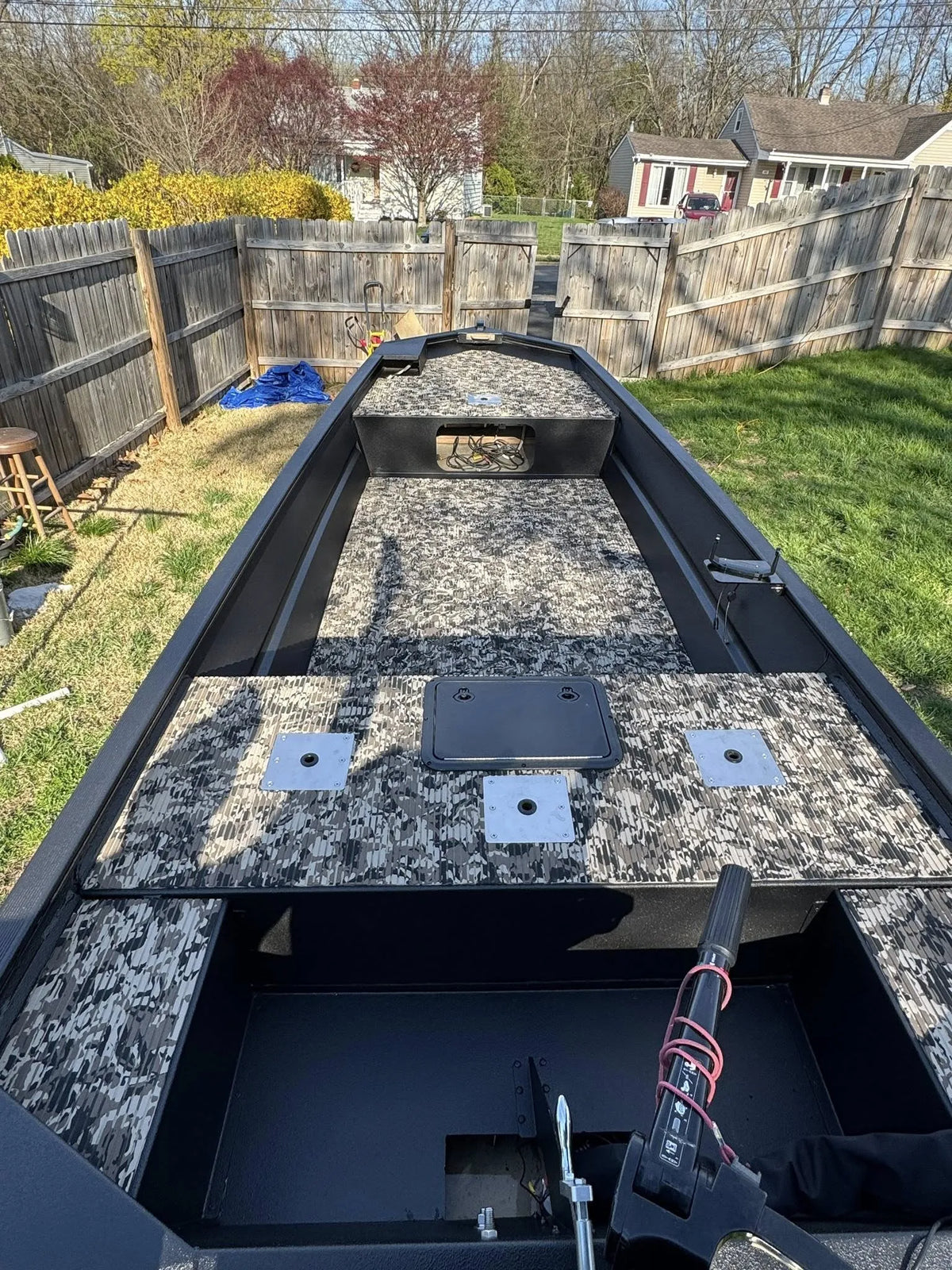 Hydro Turf Cut Groove EVA foam traction mat in TBNation Camo installed in a black jon boat.