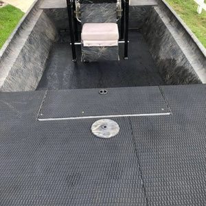 Black Hydro-Turf EVA foam traction mat with molded diamond cut pattern installed in a jon boat.