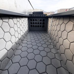 Dark gray Hydro Turf Pro Series EVA foam matting with a textured hexagonal pattern lining a boat interior.