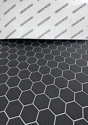 Black Hydro Turf Pro Series EVA foam mat with a textured hexagonal pattern and white outlines.