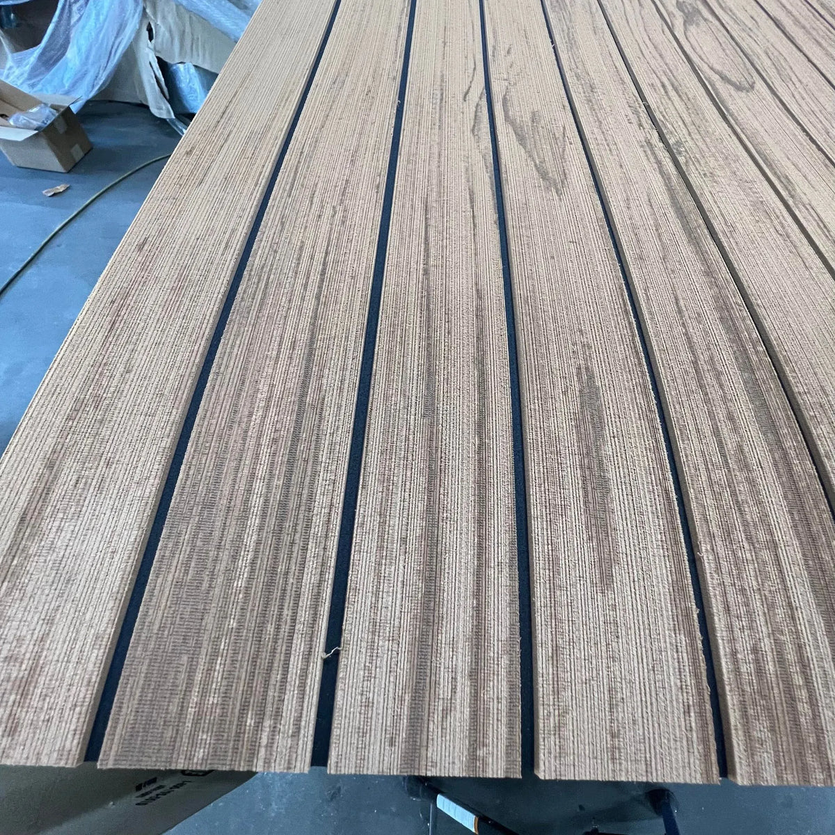 Hydro-Turf Wide Groove Laser Wood Grain EVA foam boat decking sheet with dark seams.