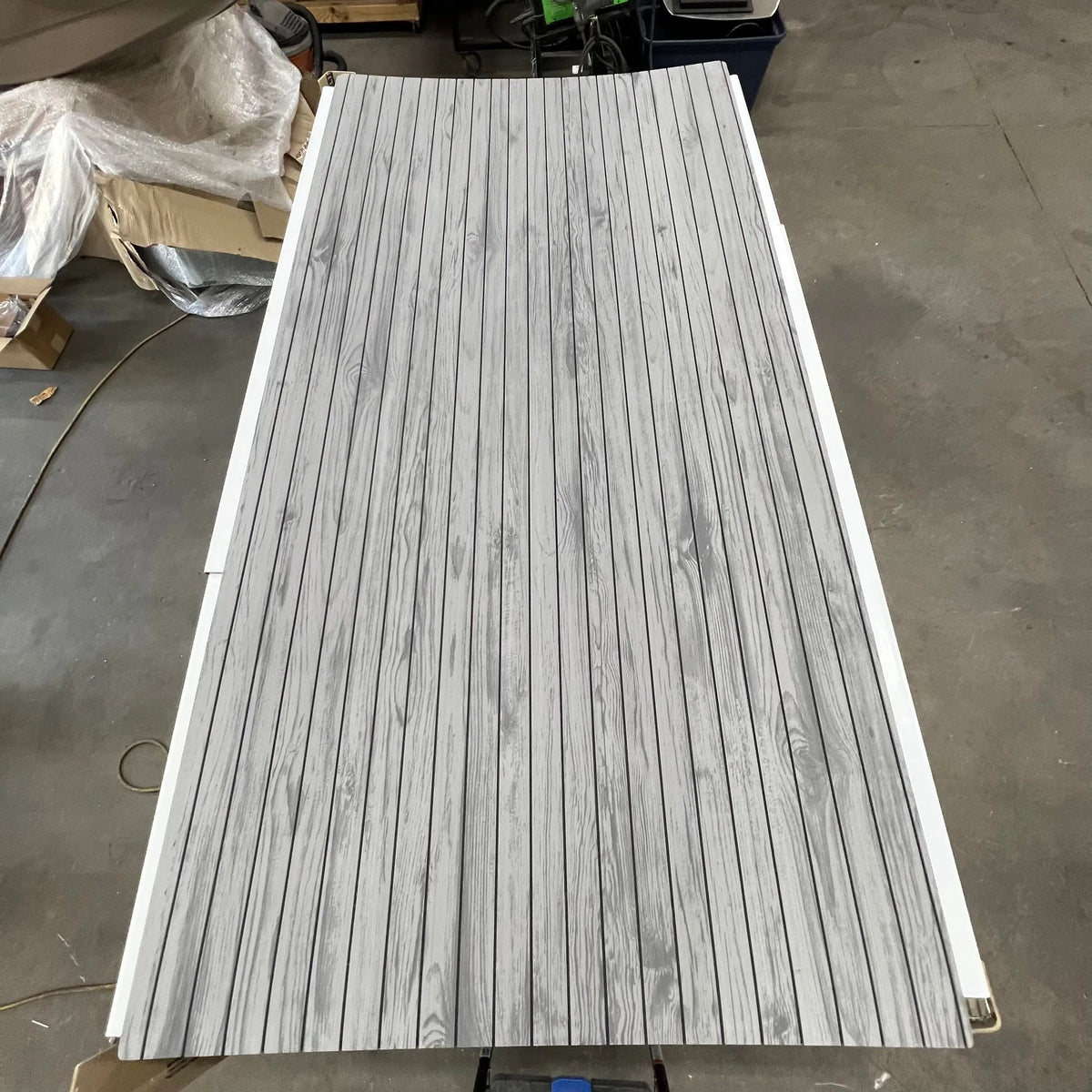 Gray Hydro-Turf Wide Groove Laser Wood Grain EVA foam boat decking sheet, 41" x 83", with adhesive.