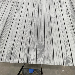Hydro-Turf Wide Groove Laser Wood Grain EVA foam decking sheet in light grey with dark grey lines.