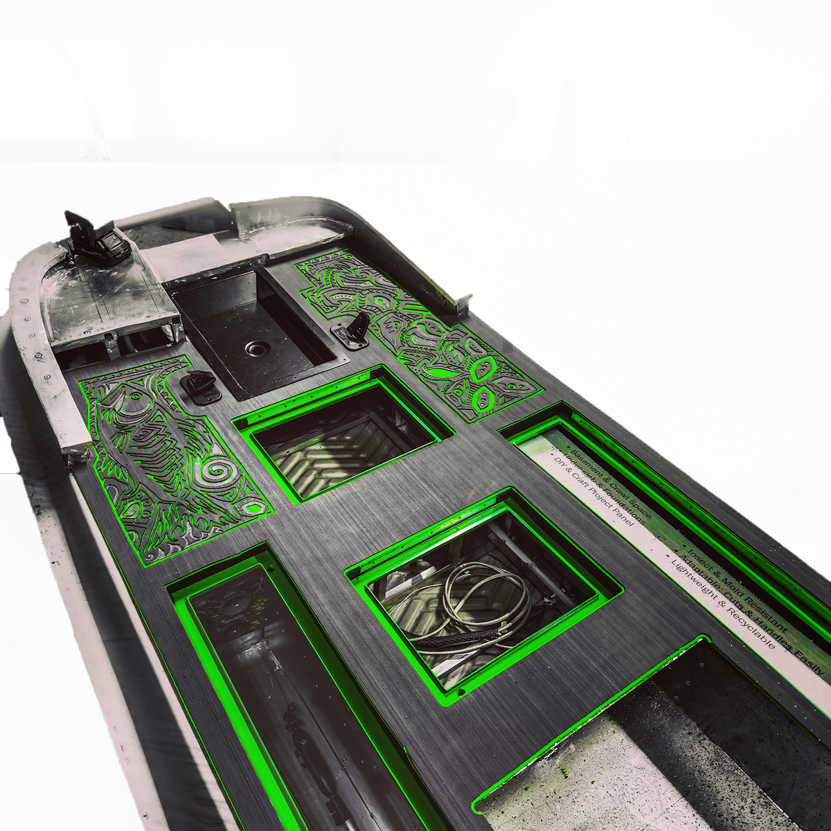 HydroTurf two-tone EVA foam decking sheets, black with bright green routed designs, installed on a boat deck.