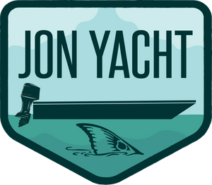 Jon Yacht Tailer 4" sticker: teal, light blue, and dark green design with a boat, outboard motor, and shark fin.