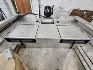 Three silver aluminum flip-up stowable JumpSeats installed in a boat, with black cushions visible.