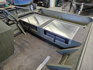 Two silver Few-Man JumpSeats installed in an olive green boat, featuring flip-up lids and black latches.