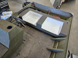 Green boat interior with two white, rectangular, flip-up stowable JumpSeats, ready for cushions.