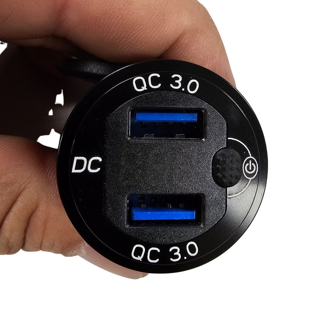 Black aluminum alloy USB voltmeter with dual blue QC 3.0 ports and power button.