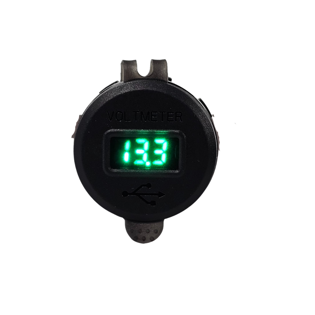 Black round LED voltmeter with green digital display and USB charging port.