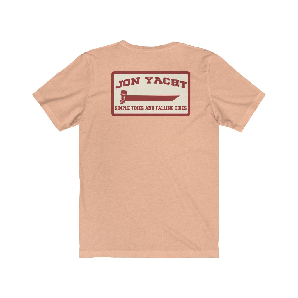Peach short sleeve jersey tee with "Jon Yacht" boat graphic and "Simple Times and Falling Tides" text.